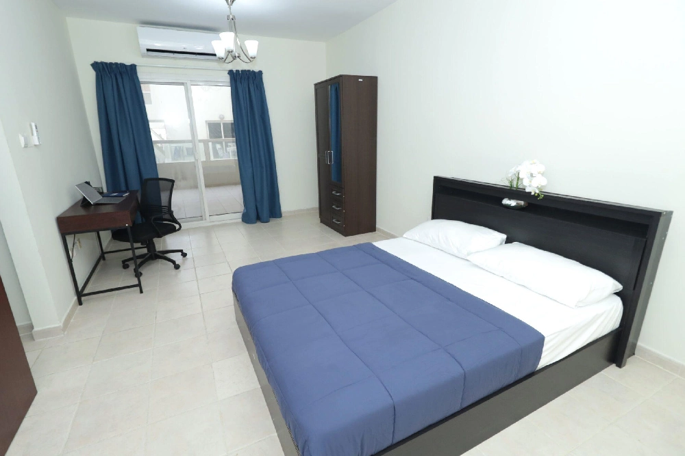 Executive Suites Dubai with workspace, balcony and spacious bedroom